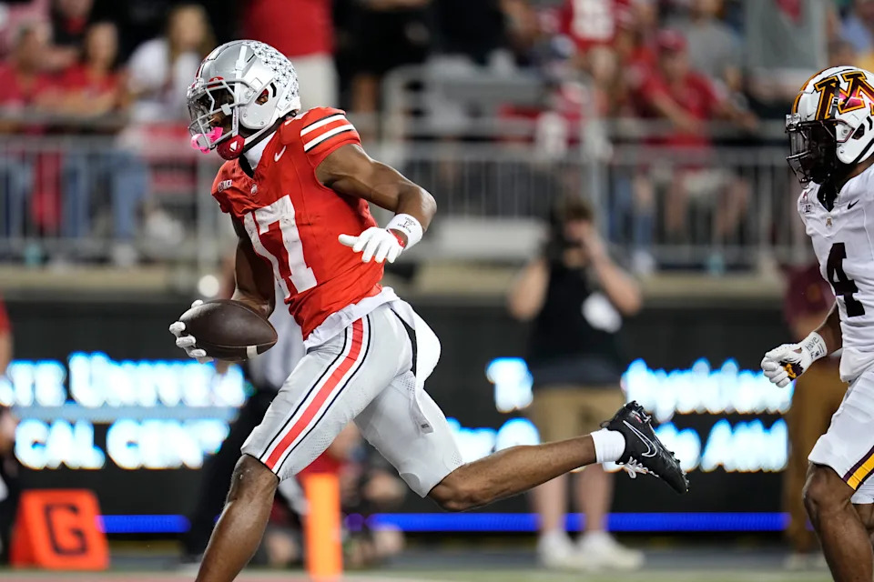 Ohio State Buckeyes wide receiver Carnell Tate (17) catches a touchdown pass during the first half of the NCAA football game against the Minnesota Golden Gophers at Ohio Stadium in Columbus on Oct. 4, 2025.
