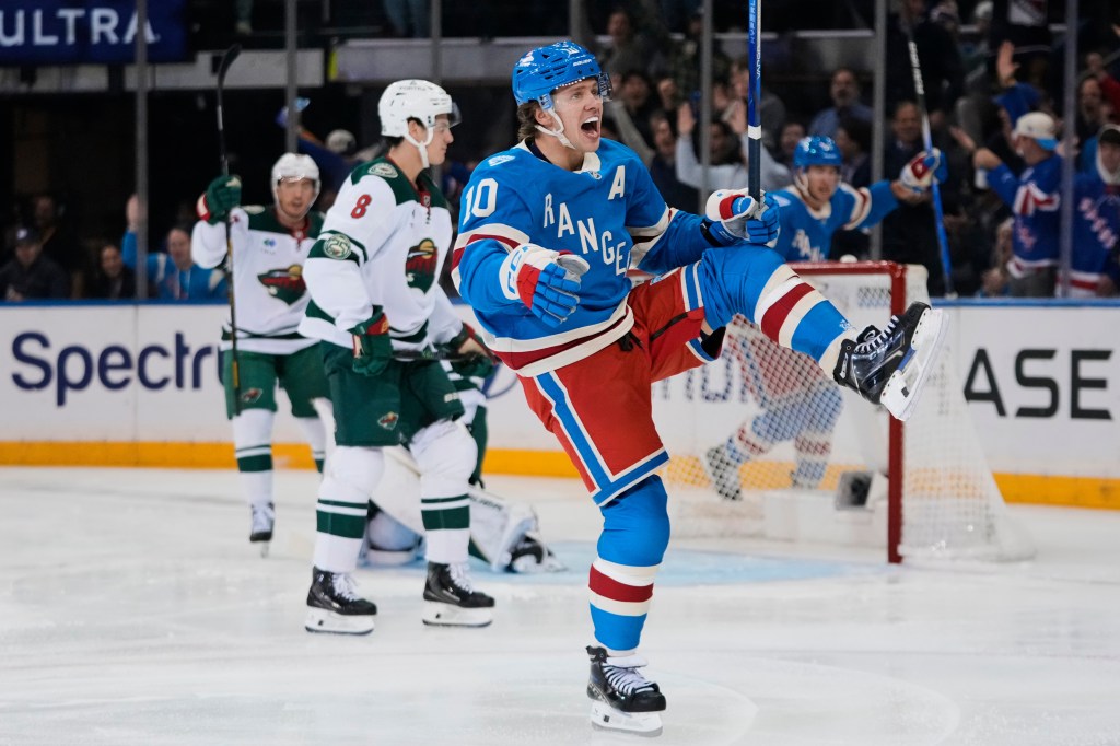New York Rangers' Artemi Panarin (10) celebrates after scoring a goal against the Minnesota Wild.