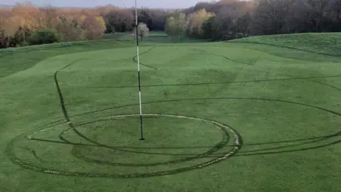 Steve Wells Damaged grass caused by motorcycles
