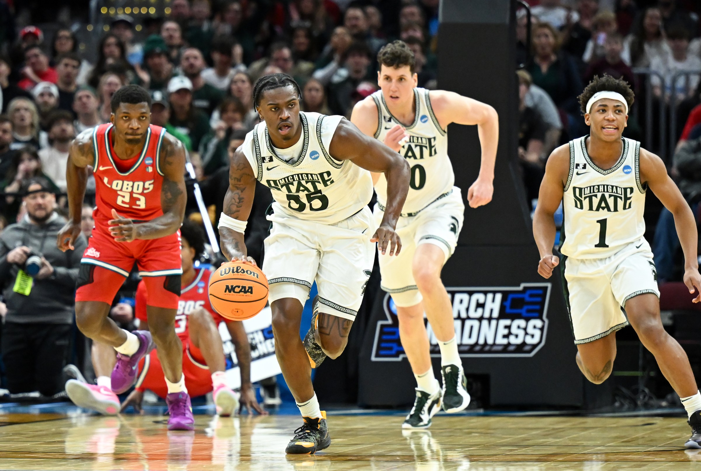 CLEVELAND, OHIO - MARCH 23: Coen Carr #55 of the Michigan State Spartans dribbles down the court during the first half in the second round of the NCAA Men’s Basketball Tournament against the New Mexico Lobos at Rocket Arena on March 23, 2025 in Cleveland, Ohio. (Photo by Nick Cammett/Getty Images)