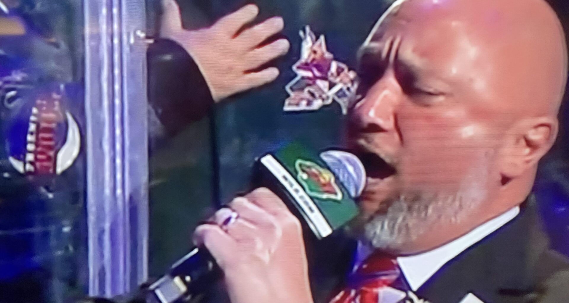 I’ve been watching Minnesota Wild games to fill the void since we lost the boys. Check out this legend behind the anthem singer 🫡