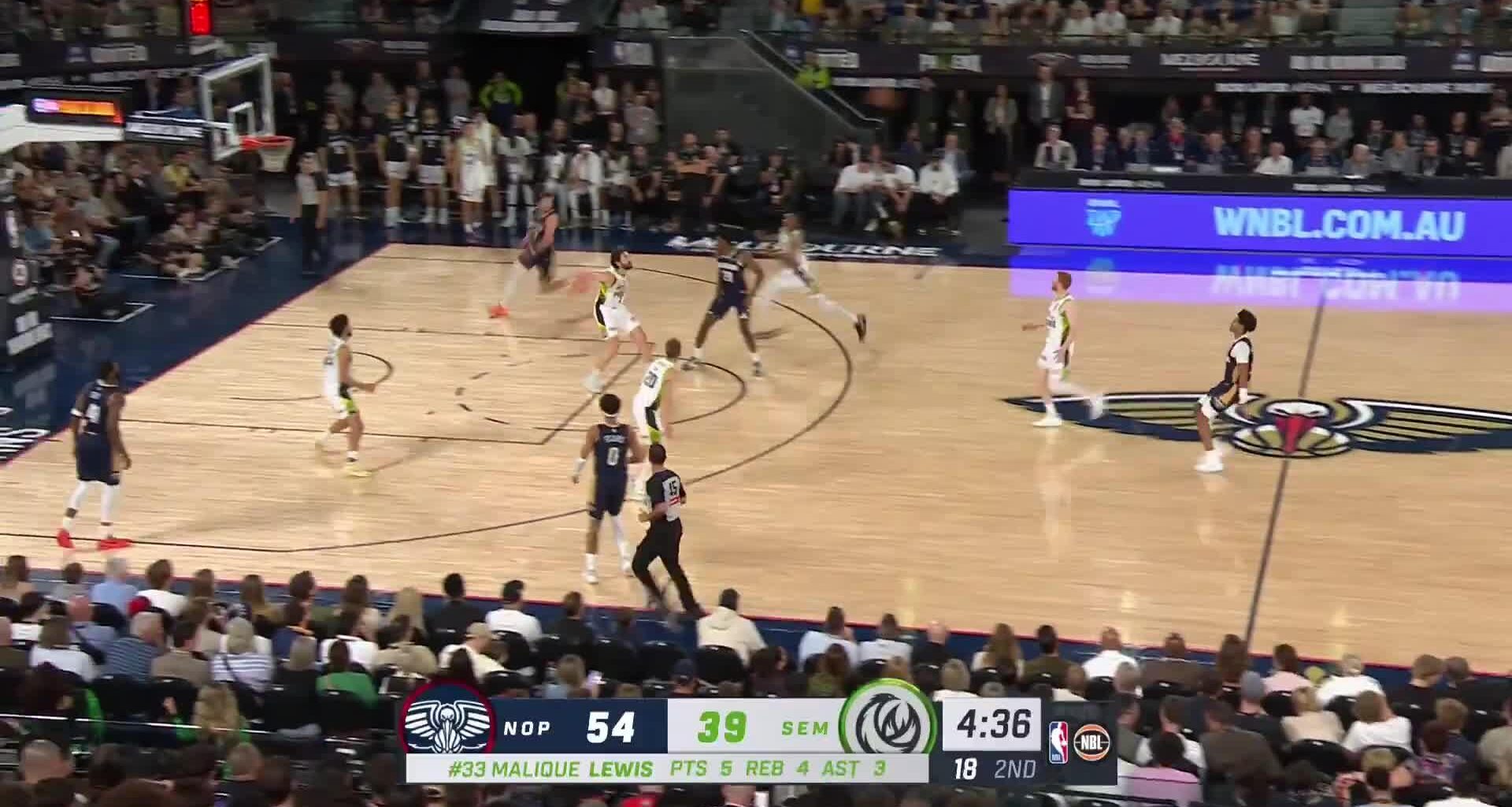 Jordan Poole throws a lob from beyond half court