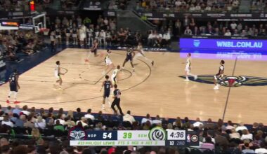 Jordan Poole throws a lob from beyond half court