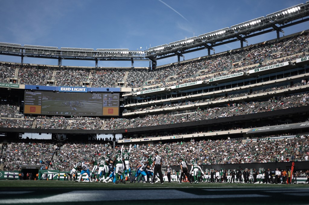 Carolina Panthers Ryan Fitzgerald (#10) kicks an extra point against the New York Jets at MetLife Stadium.