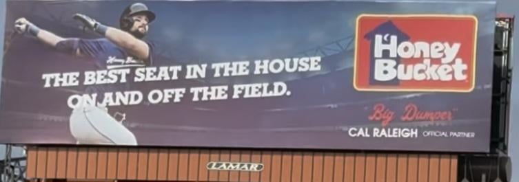An actual billboard outside of T mobile Park for a portapotty company and one of the best ive ever seen