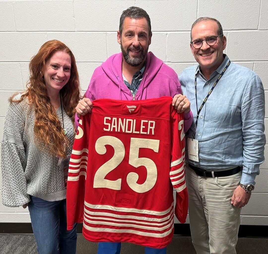 Comedian Adam Sandler gifted a Red Wings jersey after his show at LCA