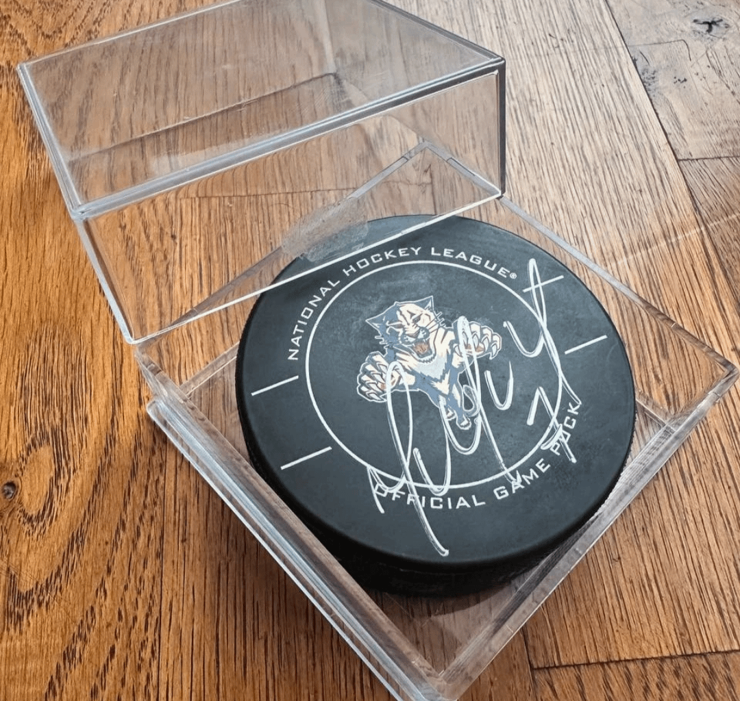 Who signed this puck?