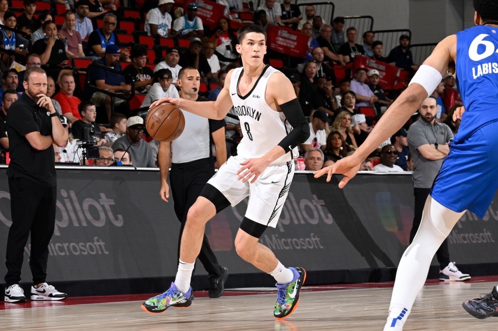 Egor Demin #8 of the Brooklyn Nets dribbles the ball against the Orlando Magic at the 2025 NBA Summer League.