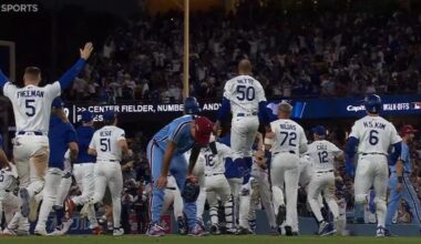 Orion Kerkering on the field as the Dodgers celebrate