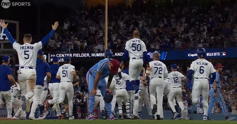 Orion Kerkering on the field as the Dodgers celebrate