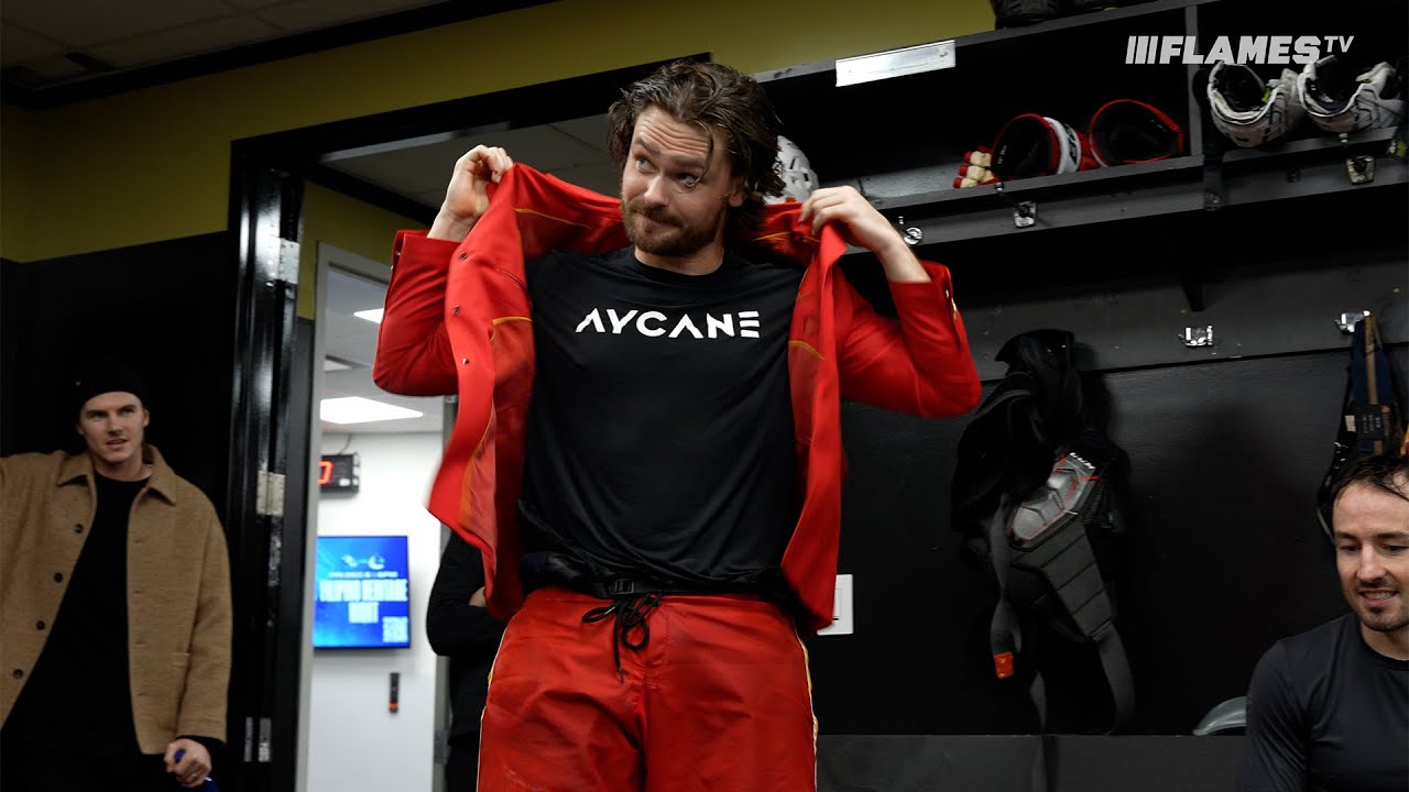 Give the puck (and blazer) to 4! Andersson leads the Flames over the Canucks