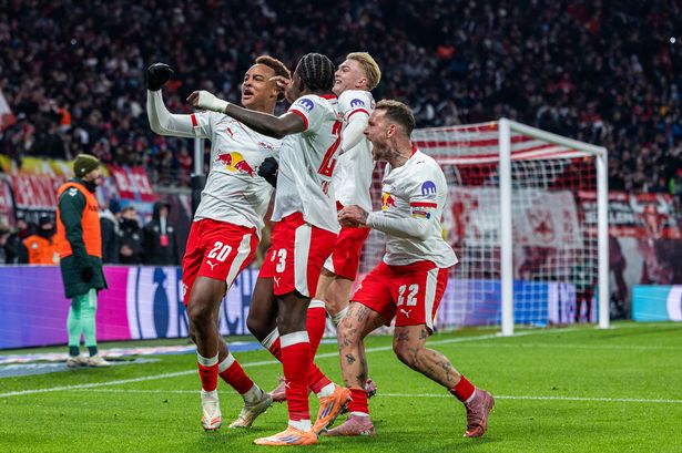 Assan Ouedraogo of RB Leipzig celebrates with teammates scoring his team's first goal during the Bundesliga match between RB Leipzig and SV Werder Bremen at Red Bull Arena on November 23, 2025 in Leipzig, Germany. 