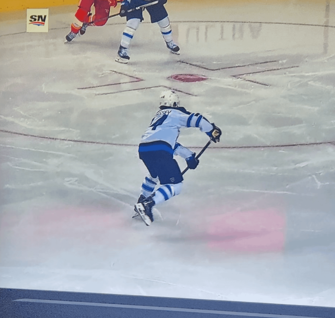 Why do the Calgary Flames constantly have lights projecting down on the ice during the live game? Answers ive been getting are saying they're projection lights but they don't play during live play and only at stoppages but here is proof