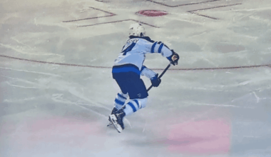 Why do the Calgary Flames constantly have lights projecting down on the ice during the live game? Answers ive been getting are saying they're projection lights but they don't play during live play and only at stoppages but here is proof