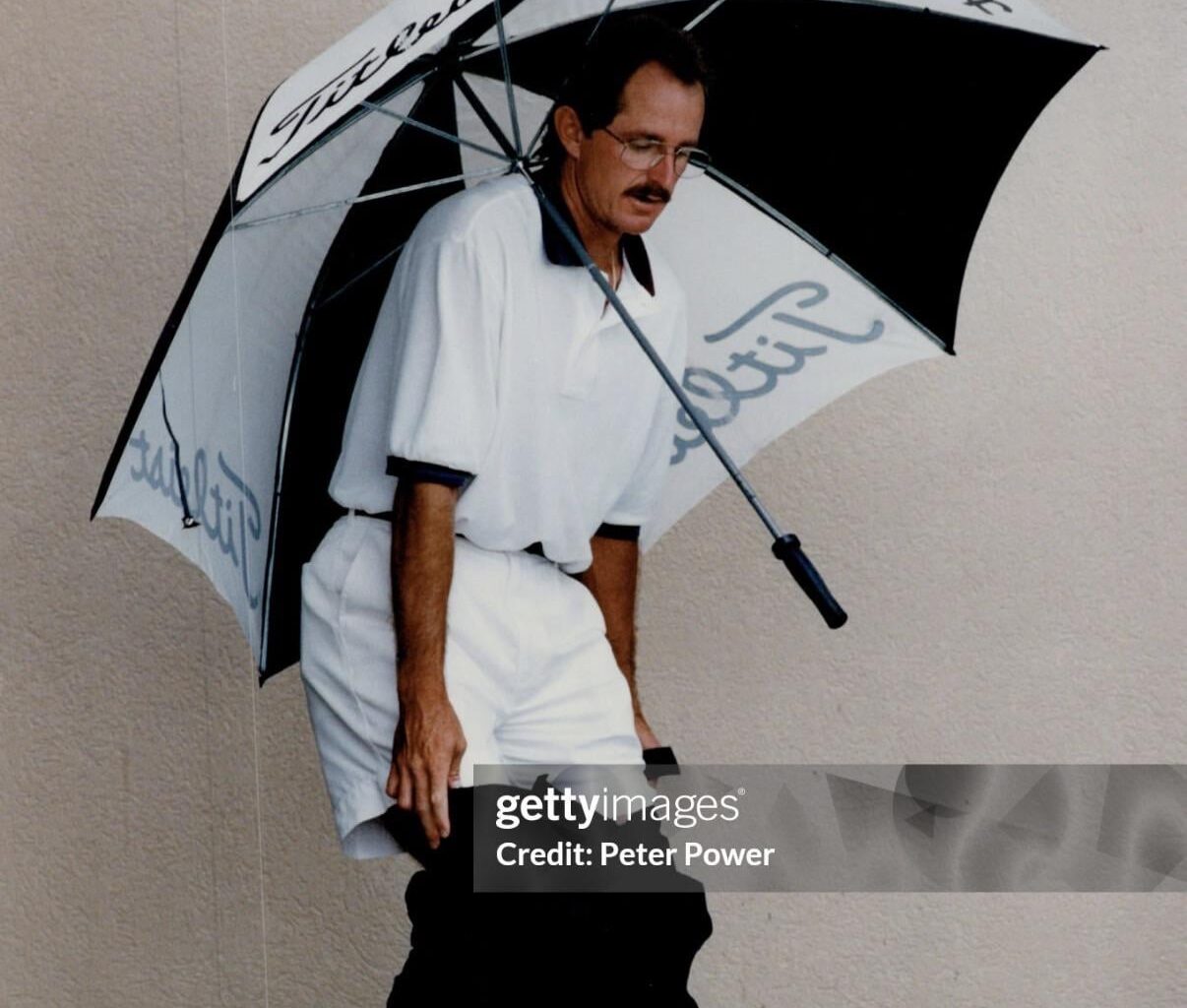 Day 1 - Posting a photo of Rance Mulliniks awkwardly holding a golf umbrella while pulling his pants up or down until the Jays sign a Major League bat or until I run out of photos of Rance Mulliniks awkwardly holding a golf umbrella while pulling his pants up or down