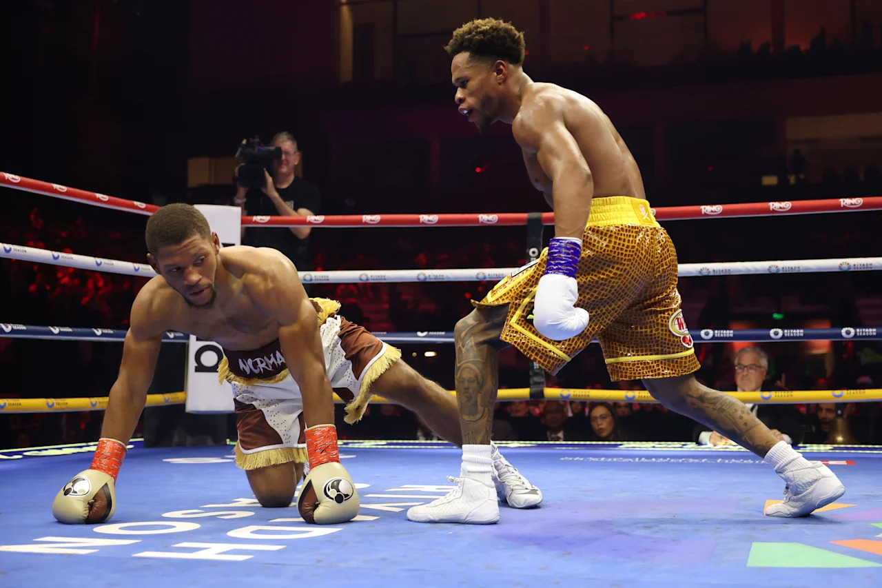 RIYADH, SAUDI ARABIA - NOVEMBER 22: (L-R) Brian Norman Jr. is knocked down by Devin Haney in a WBO world welterweight title fight during Ring IV: Night of the Champions at ANB Arena on November 22, 2025 in Riyadh, Saudi Arabia. (Photo by Richard Pelham/Getty Images)
