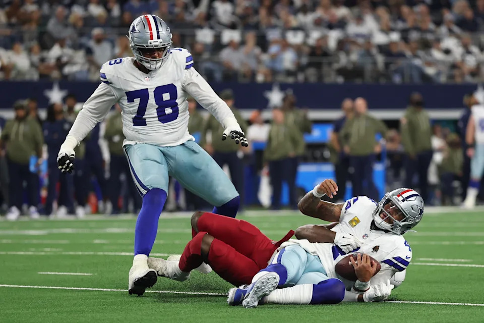 ARLINGTON, TEXAS - NOVEMBER 03: Dak Prescott #4 of the Dallas Cowboys is sacked by Josh Sweat #10 of the Arizona Cardinals during the third quarter in the game at AT&T Stadium on November 03, 2025 in Arlington, Texas. (Photo by Stacy Revere/Getty Images)