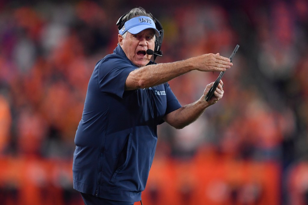 North Carolina head coach Bill Belichick calls a timeout during the first half of an NCAA college football game against Syracuse, Friday, Oct. 31, 2025, in Syracuse, N.Y. 