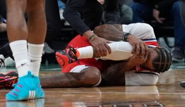 Los Angeles Clippers F Derrick Jones Jr. helped to locker room with apparent knee injury following collision