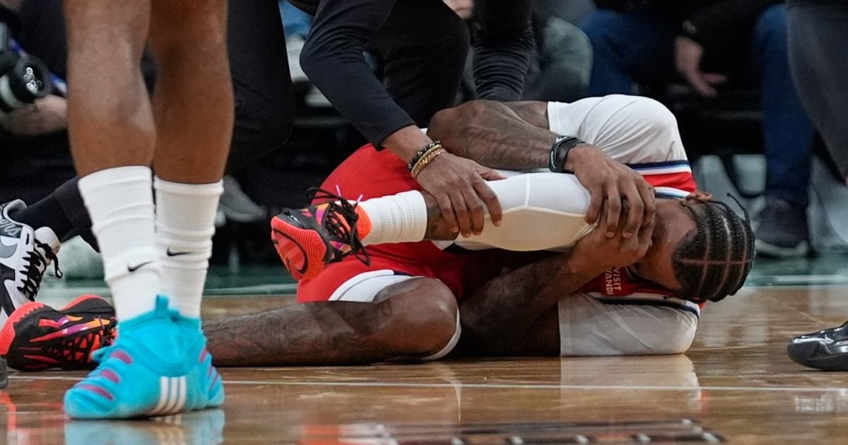 Los Angeles Clippers F Derrick Jones Jr. helped to locker room with apparent knee injury following collision