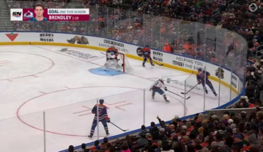 Oldest active player in the league, Brent Burns, making a great defensive play against Leon Daisaitl.