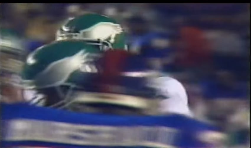 Randall Cunningham rolls out and showcases his incredible athleticism, avoiding a Carl Banks sack and throwing a perfect pass. 10/10/1988.