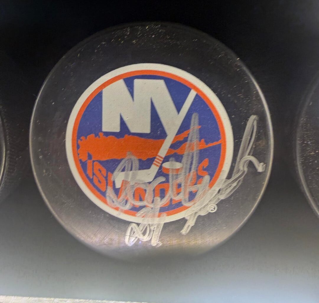 Who signed these pucks