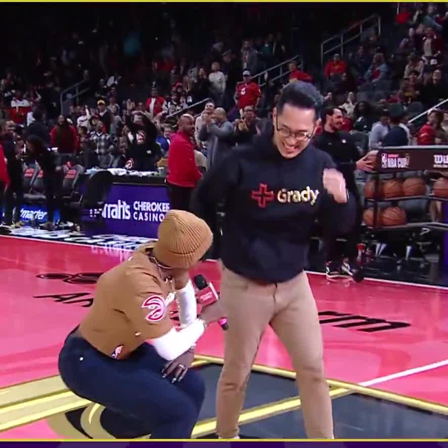 An Atlanta Hawks fan hits a half court shot for $10,000 and proceeds to celebrate in an interesting way
