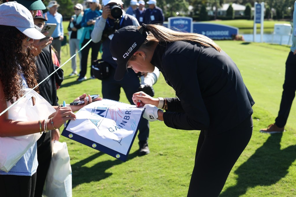 Kai Trump, the granddaughter of President Trump, tees off on the 10th hole during the first round of The ANNIKA at the Pelican Golf Club at on Thursday, Nov. 13, 2025