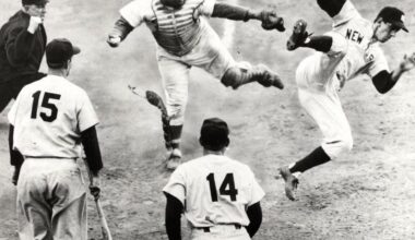 Dodgers catcher Roy Campanella on October 2, 1953 secures the final out of Game Four of the World Series by knocking Yankees second baseman Billy Martin away from the plate. The moment captures the intensity of the legendary Dodgers-Yankees rivalry.