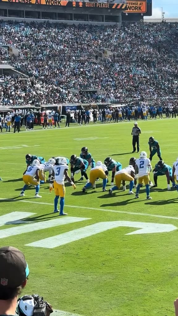 Tuten drives two defenders into the endzone.