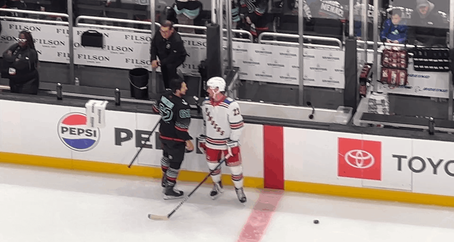 Adam Fox, whose father in law has ALS, checks in on Brandon Montour during warm ups