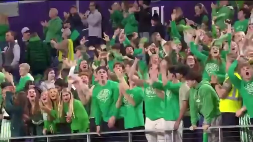 Blackhawks first round pick Mason West concludes his HS football career with a Minnesota state championship as he is holding up the trophy as his teammates celebrate around him. What a moment