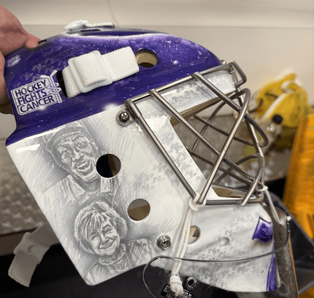 Juice's Hockey Fights Cancer mask featuring Craig “Partner” Baugh, Shelia Crisp, Lexie Rogers, and Erin Daunic.