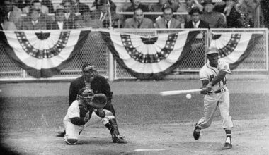 Hank Aaron driving a ball during the 1957 World Series at Yankee Stadium. He hit .393 with 3 HR and 7 RBI in the Series which the Braves won 4 games to 3.