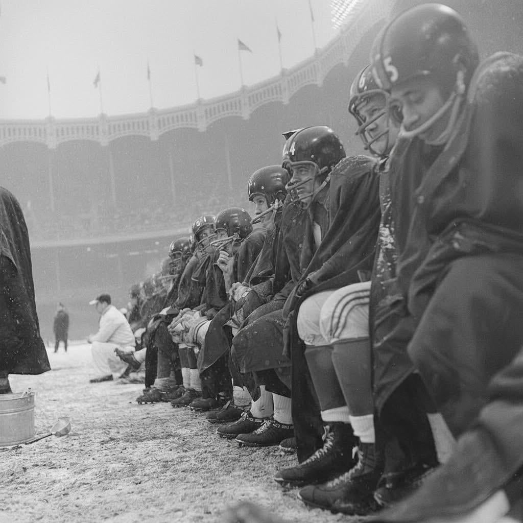 Giants players trying to stay warm on the sidelines against the Cleveland Browns at Yankee Stadium in the Bronx, December 14, 1958