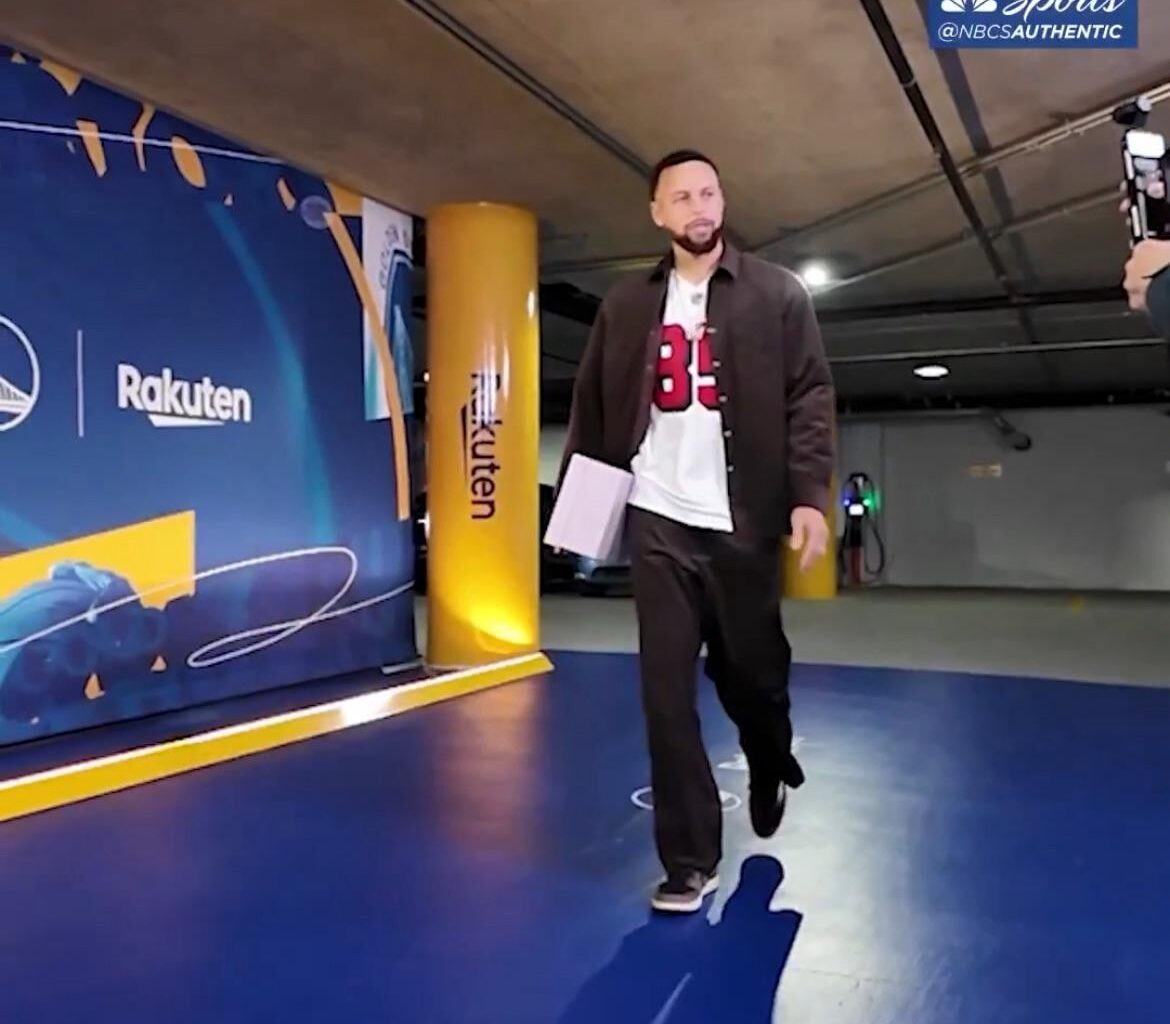 Steph Curry arriving at Chase center wearing a George Kittle jersey.