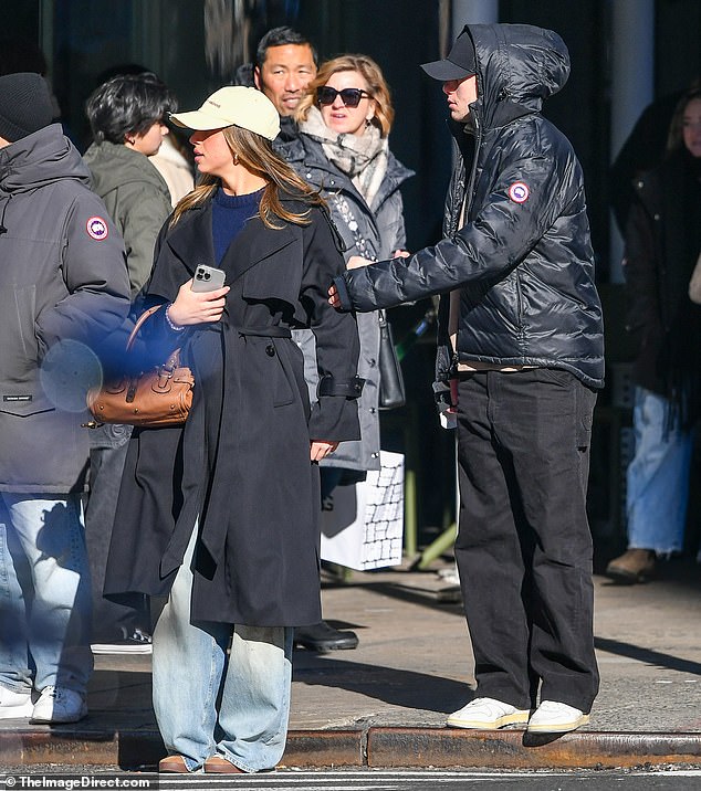 Meanwhile, Jack wrapped up warm in a padded coat which he pair with a beige quarter zip sweater