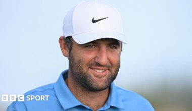 Scottie Scheffler smiles during a round