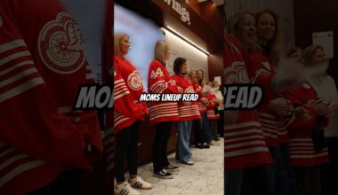 Detroit Red Wings moms read the starting lineup ahead of the game