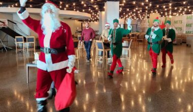 Santa Clay Holmes and his elves Nolan McLean, Brandon Sproat, and Jonah Tong