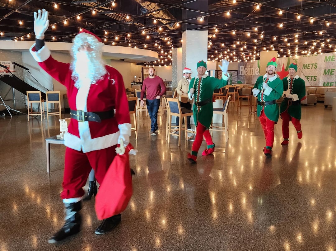 Santa Clay Holmes and his elves Nolan McLean, Brandon Sproat, and Jonah Tong