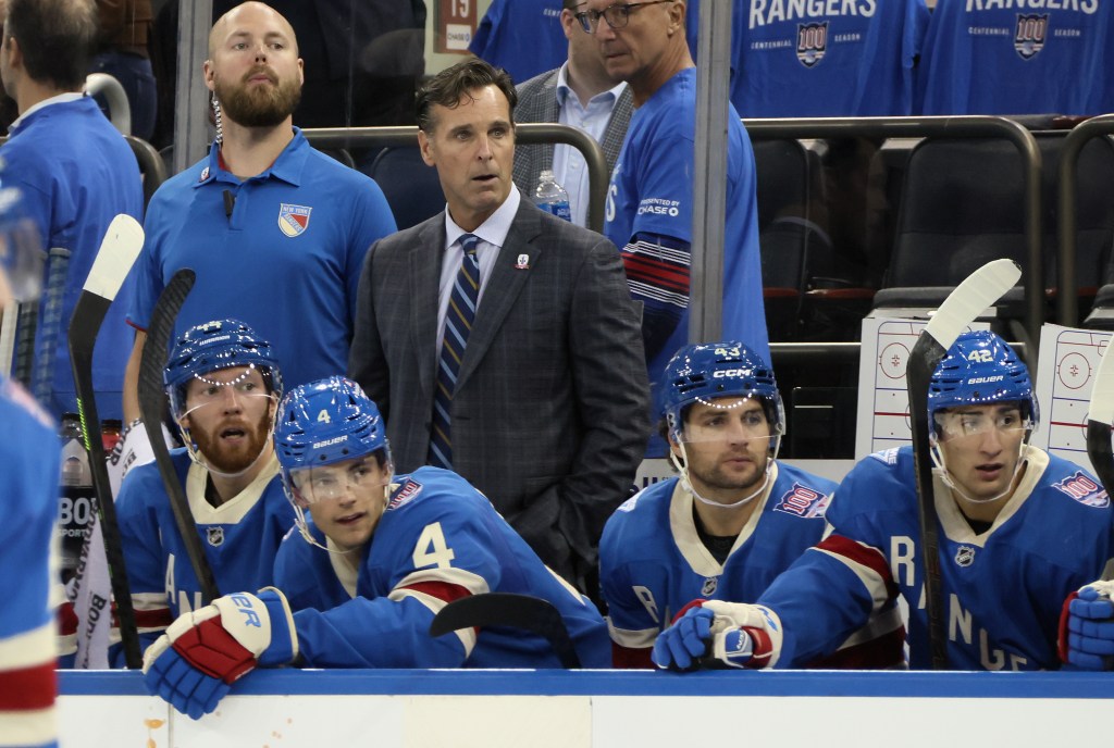 Assistant coach David Quinn of the New York Rangers tends to the bench during the game against the Pittsburgh Penguins at Madison Square Garden on October 07, 2025