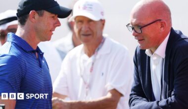 Rory McIlroy chatting to DP World Tour chief executive Guy Kinnings