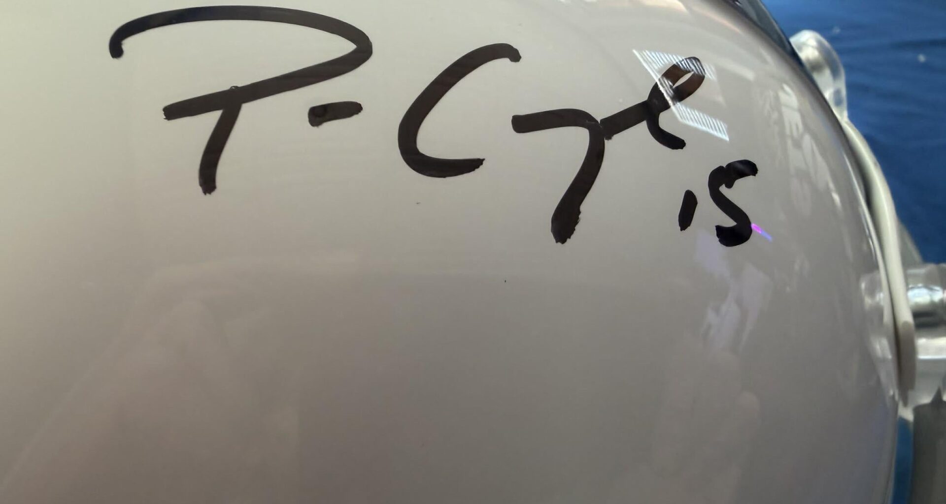 Help my dad got a mystery box of signed helmet and I can’t figure out who this is