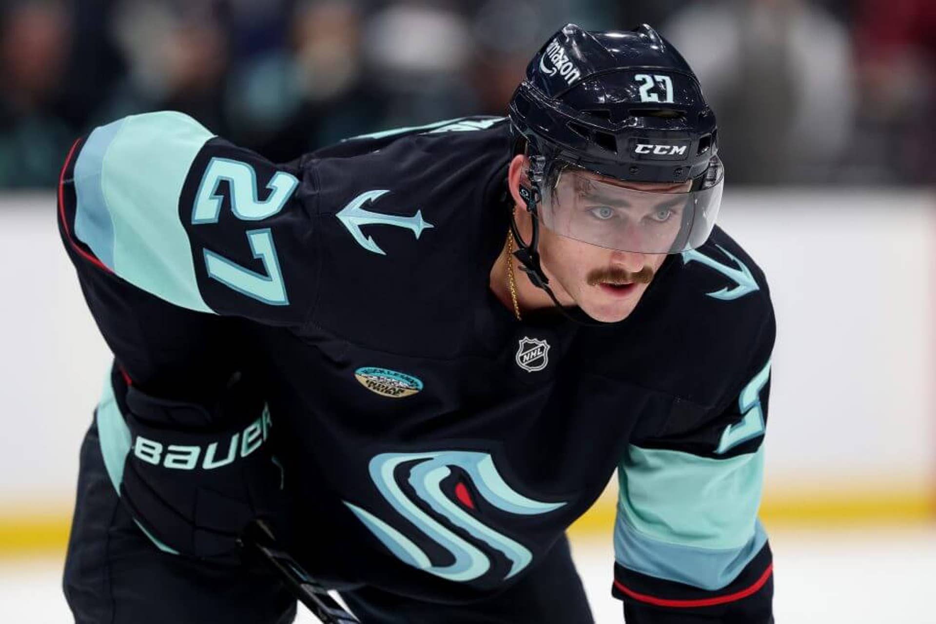 Kraken's Mason Marchment looks on during an NHL game against the Avalanche.