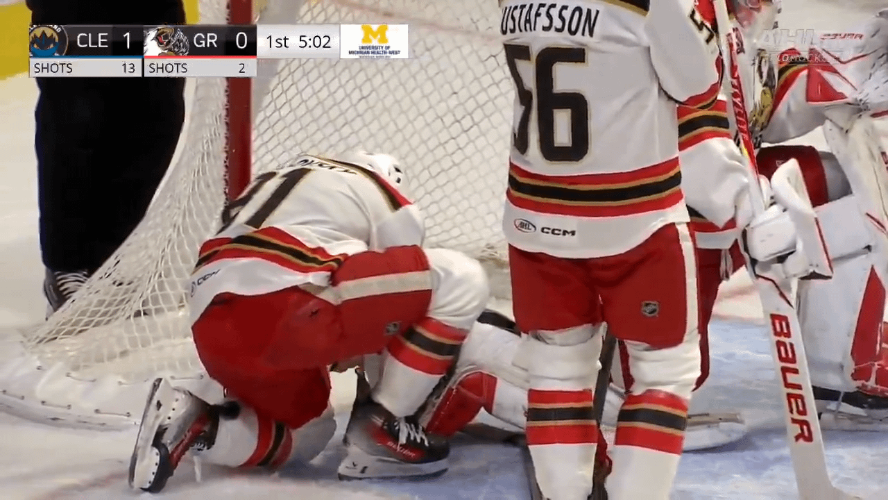 Cossa gets help from his teammate and aspiring equipment manager, Rychlovský, after losing a skate blade
