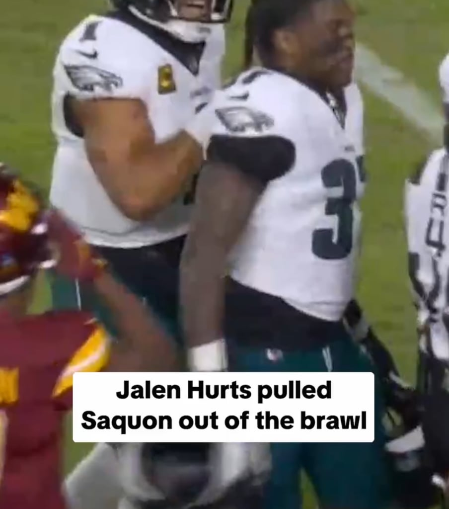 Jalen Hurts snatching his RBs up and out of the brawl.