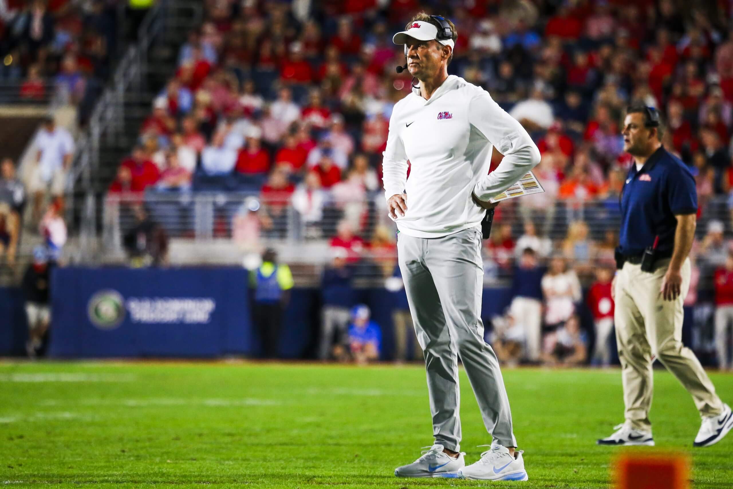 Lane Kiffin looks on to the field. 