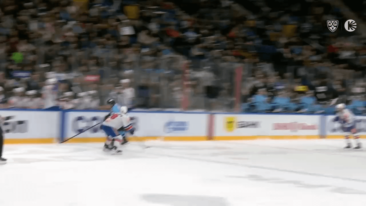 (KHL) Markus Phillips body checks Vitaly Pinchuk into Yegor Zavragin on the bench